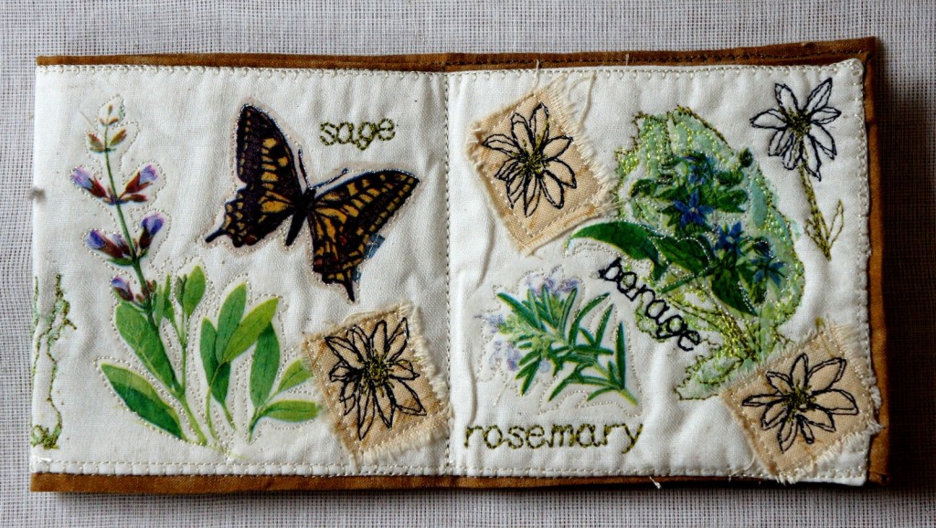 'book-in--box': calico base, fused herbal napkin images, embroidered text and free-machine daisy embellishments