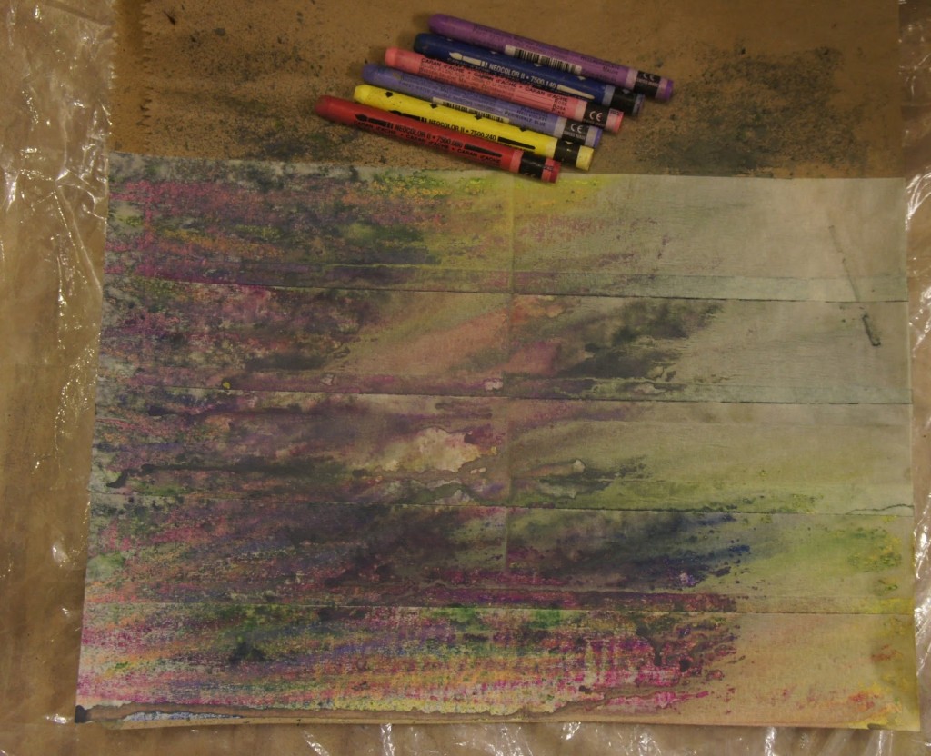 Creating journal pages from paper bags, masking tape and water-soluble crayons.