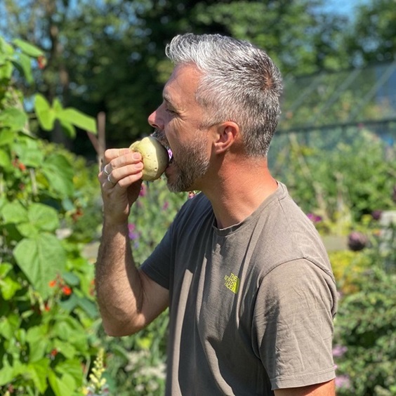 Dobies new vegetable seed range 2023 includes this new turnip 'silky sweet' variety pictured with Rob Smith taking a bite from one of the turnips in his allotment